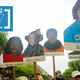 Signs depicting women of color scientists at the March for Science in April. Photo: Getty